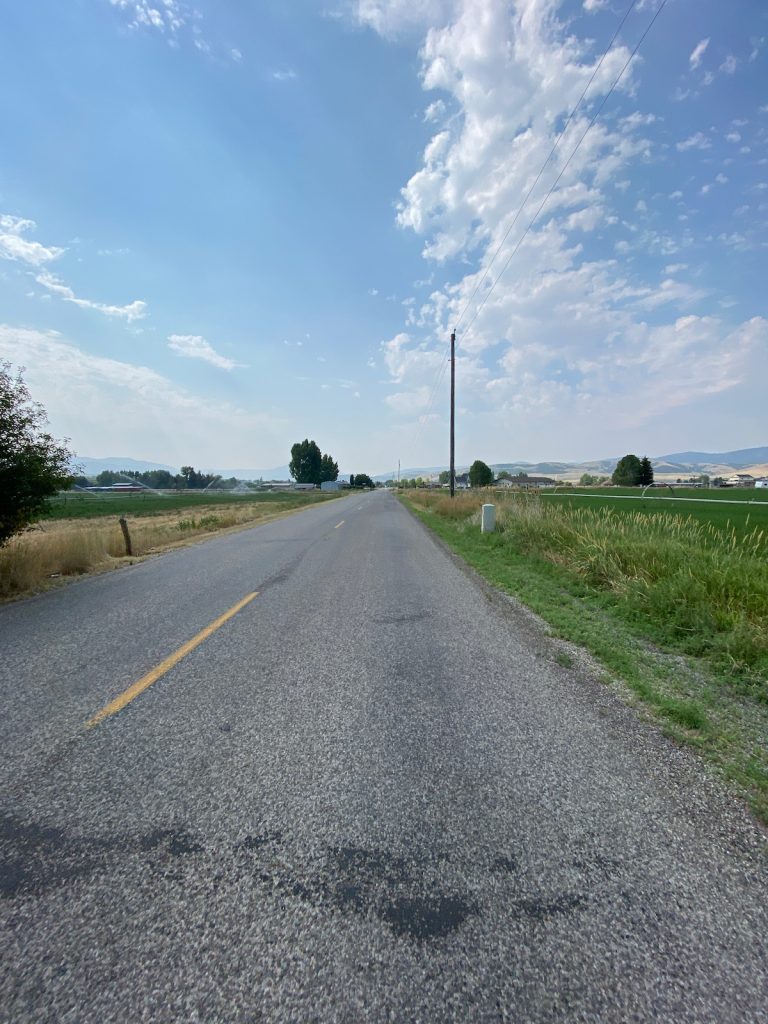 Empty country road headed south to Paradise, Utah