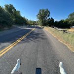 View of the road from the handlebars on the way out to Porcupine
