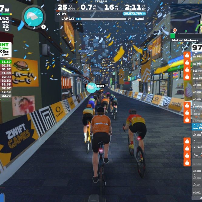 A group of cyclists in a virtual racing environment on Zwift, competing in the "Alley Sprint" event. The scene shows various cyclists in colorful jerseys, with race statistics and leaderboard details displayed on the side. The background features a street with festive decorations and banners.