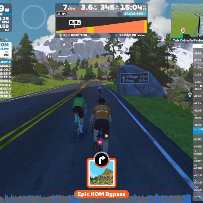 Three virtual cyclists ride on a winding road in a scenic mountainous landscape. The interface displays performance metrics, including power output and heart rate. A leaderboard shows ranks and times for the "Epic KOM" challenge. Road signs indicate distances to key locations. The right side displays nearby users in the Zwift app.