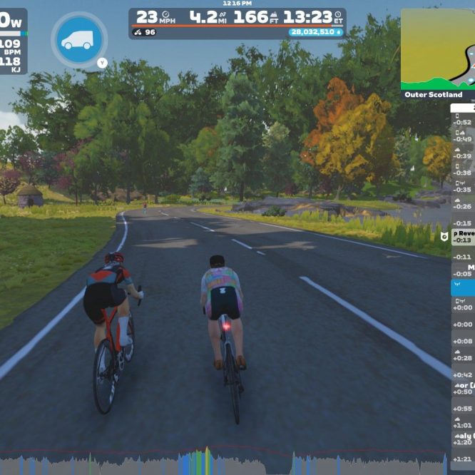 Two cyclists ride side by side on a virtual road in Zwift, surrounded by colorful trees and greenery. The on-screen display shows their speed, power output, and metrics such as heart rate and distance covered. A map in the corner indicates their location in Outer Scotland.
