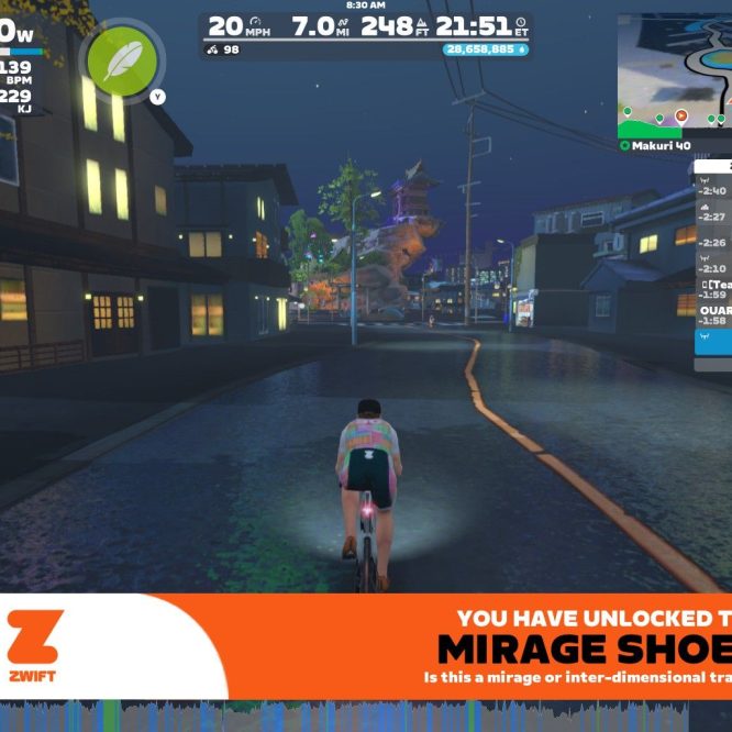 A cyclist in a virtual environment rides on a road at night, with illuminated buildings lining the street. The cyclist's stats display on the left, showing power, speed, and heart rate. A message at the bottom indicates the unlocking of "Mirage Shoes." The scene includes a mini-map on the right with data about nearby riders.