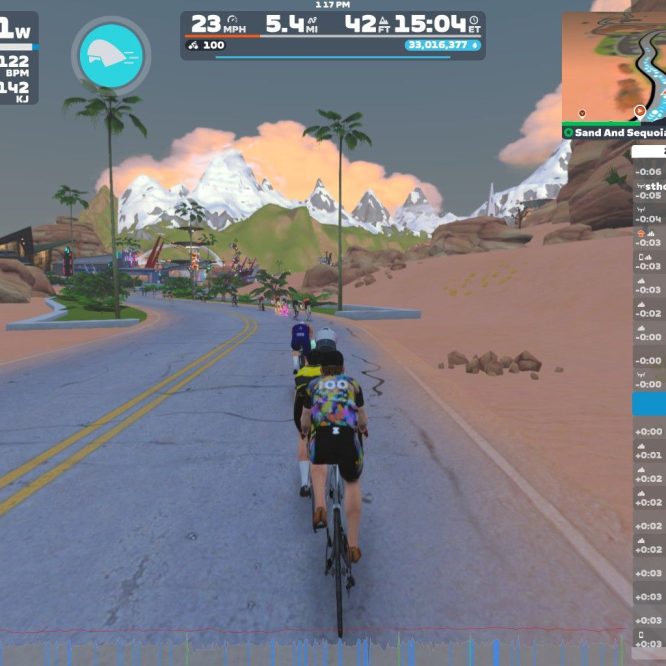 A virtual cycling scene in Zwift, showing cyclists riding on a road with palm trees and mountains in the background. The cyclists are near a turn, and a leaderboard displays nearby riders' names and statistics. The interface shows various performance metrics like power, speed, and distance.